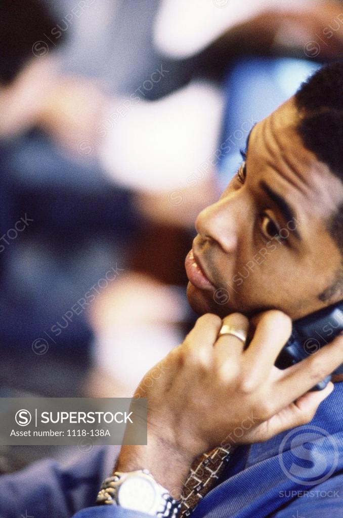 Stock Photo: 1118-138A High angle view of a businessman talking on a mobile phone