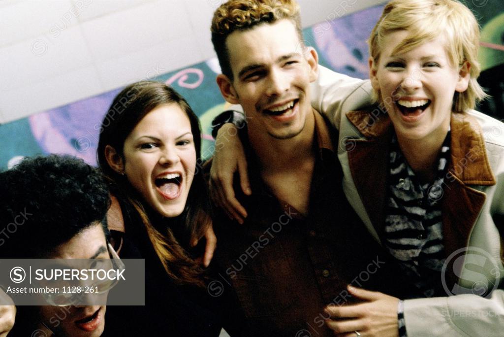 Stock Photo: 1128-261 Portrait of young people standing side by side laughing