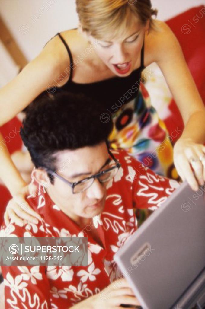 Stock Photo: 1128-342 High angle view of a young man using a laptop