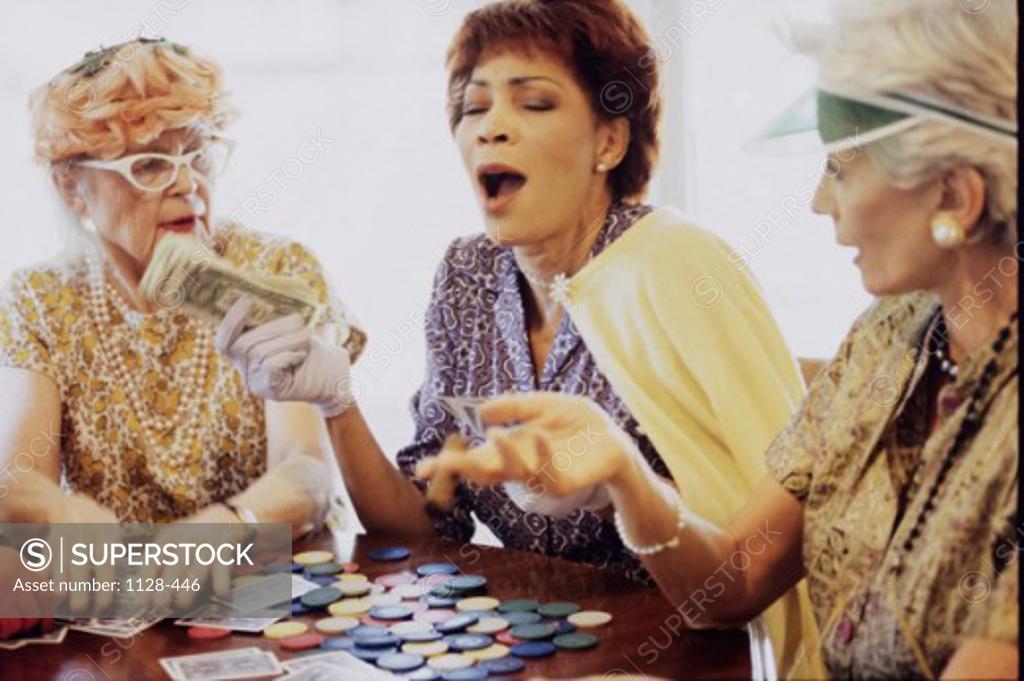 Stock Photo: 1128-446 Three senior women playing cards
