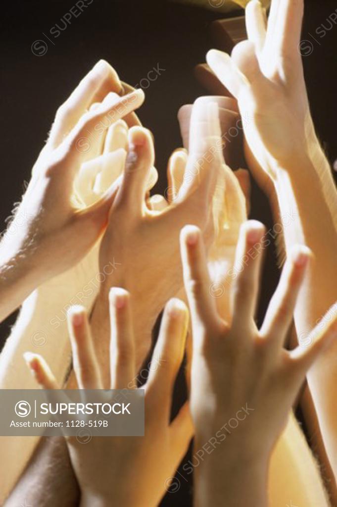 Stock Photo: 1128-519B Close-up of people's hands reaching up