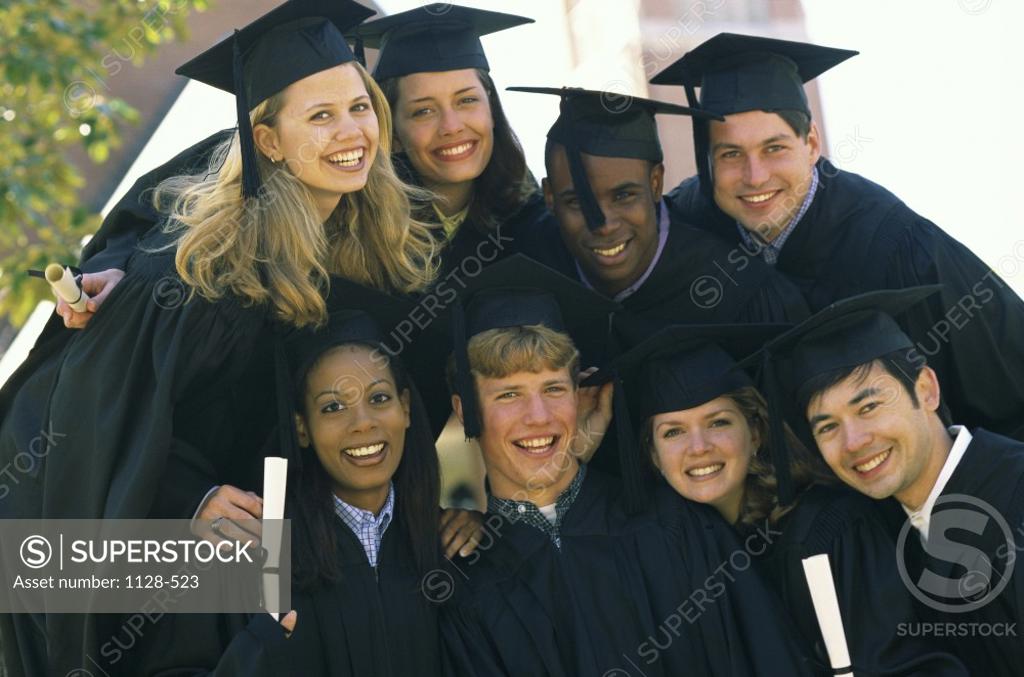 Stock Photo: 1128-523 Portrait of a group of young graduates smiling