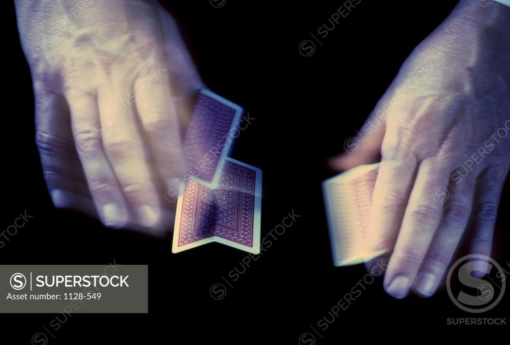 Stock Photo: 1128-549 Person shuffling playing cards
