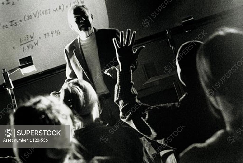 Stock Photo: 1128-556 Male professor giving a speech in a classroom