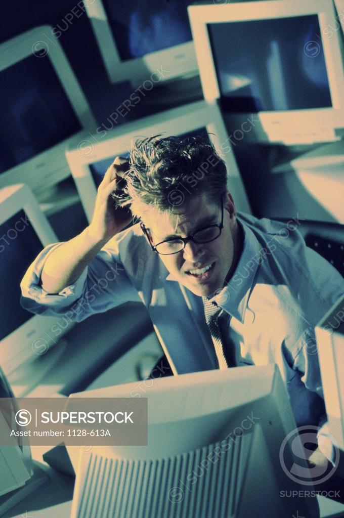 Stock Photo: 1128-613A High angle view of a businessman in an office