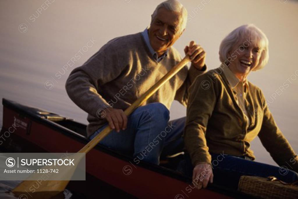 Stock Photo: 1128-742 Portrait of senior couple in a row boat