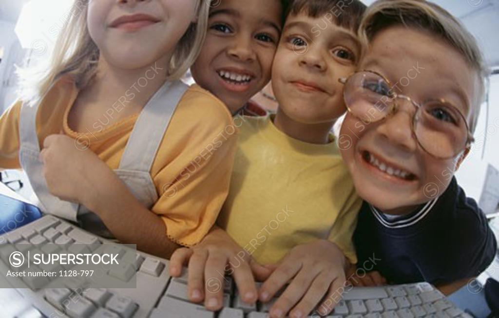 Stock Photo: 1128-797 Students at a keyboard in a computer class