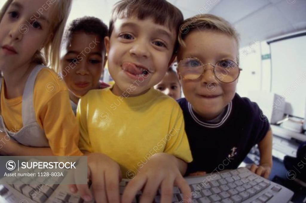 Stock Photo: 1128-803A Portrait of a group of children using a computer