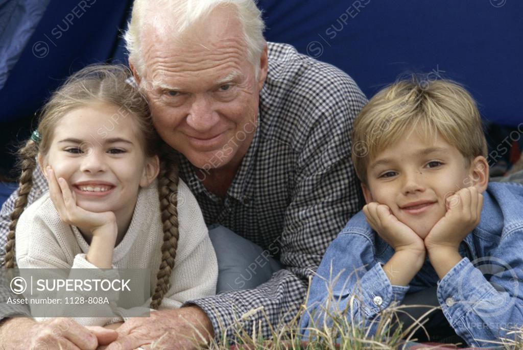 Stock Photo: 1128-808A Portrait of a grandfather with his grandson and granddaughter