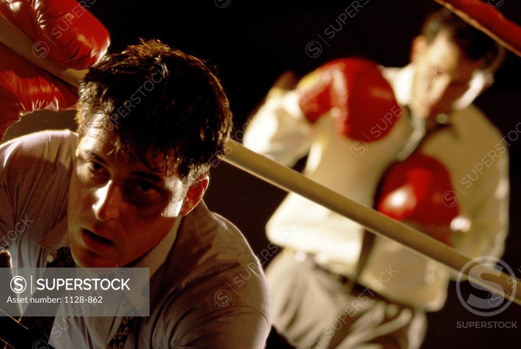 Stock Photo: 1128-862 Two businessmen in a boxing ring