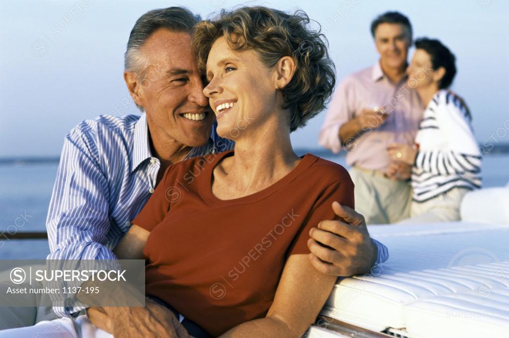 Stock Photo: 1137-195 Two mid adult couples together on a boat