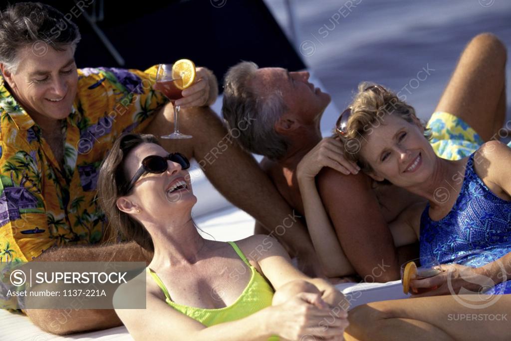 Stock Photo: 1137-221A Two couples together on a boat