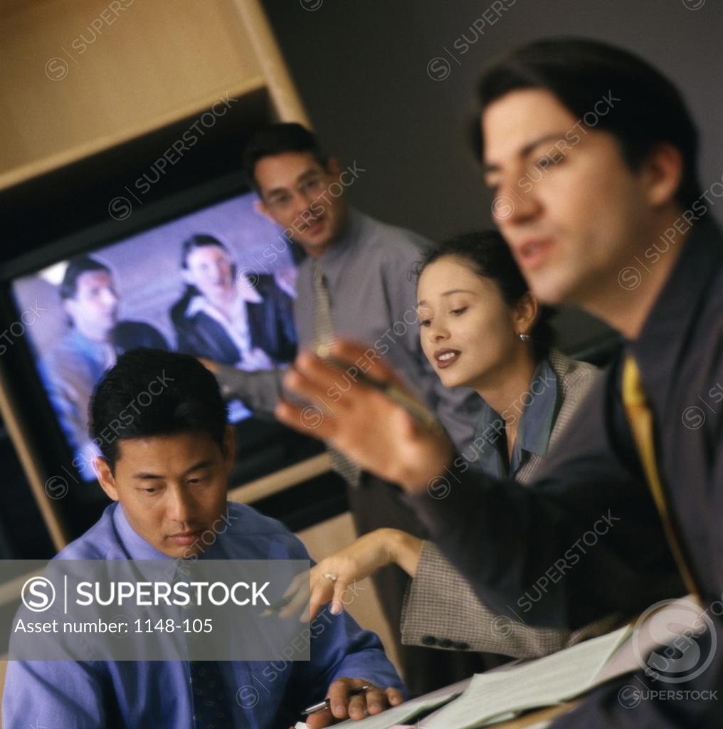 Stock Photo: 1148-105 Group of business executives in a meeting