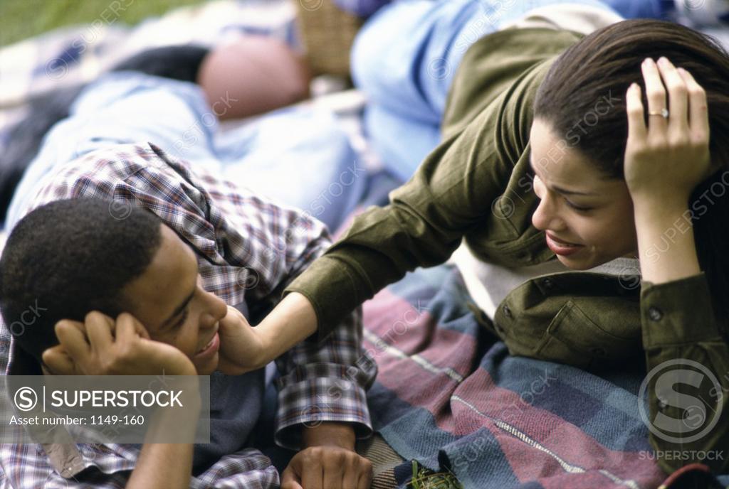 Stock Photo: 1149-160 Young couple lying down together