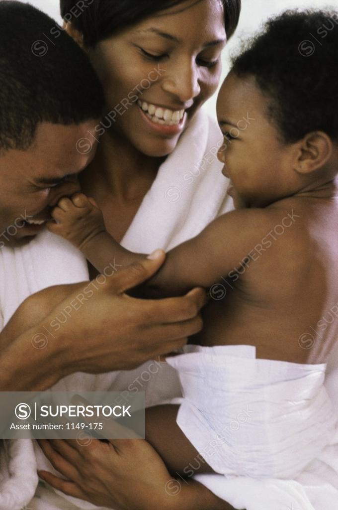 Stock Photo: 1149-175 Parents playing with their baby boy