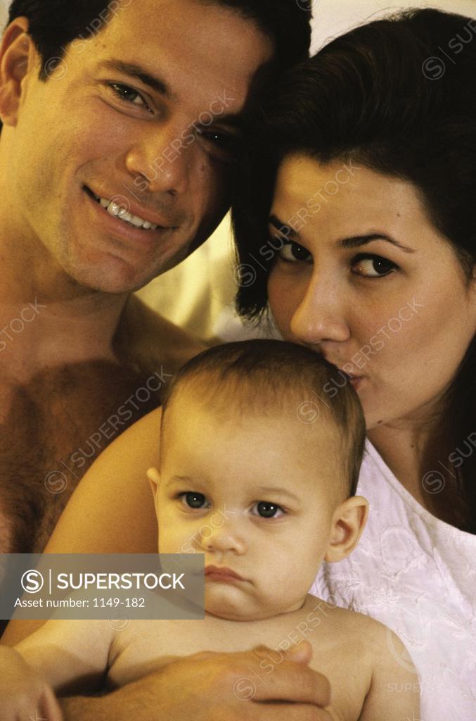 Stock Photo: 1149-182 Portrait of parents holding their baby boy