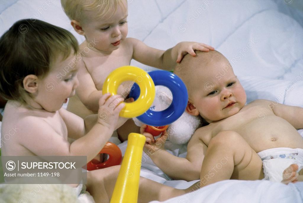Stock Photo: 1149-198 Three baby boys playing together