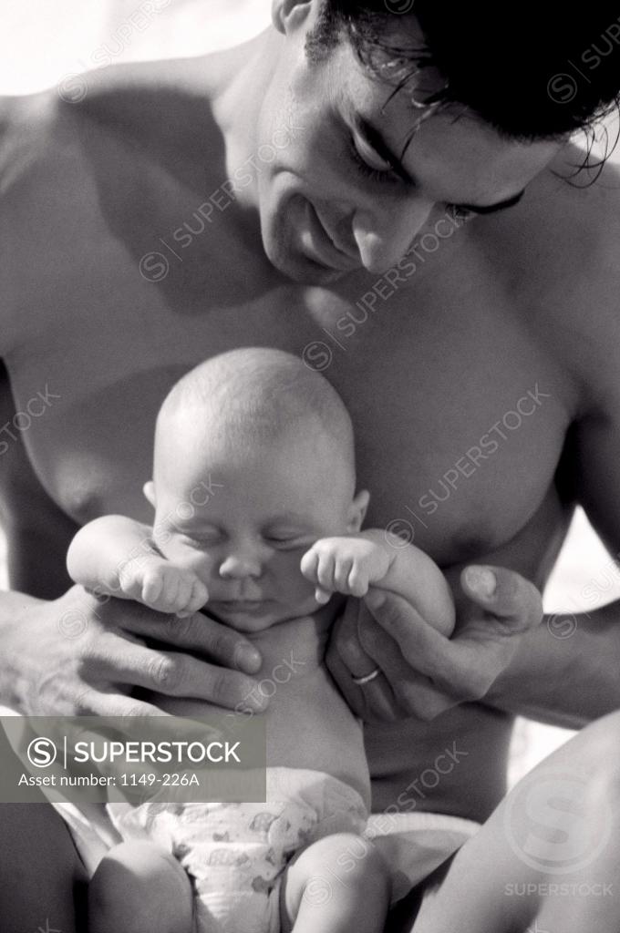 Stock Photo: 1149-226A Father holding his baby boy