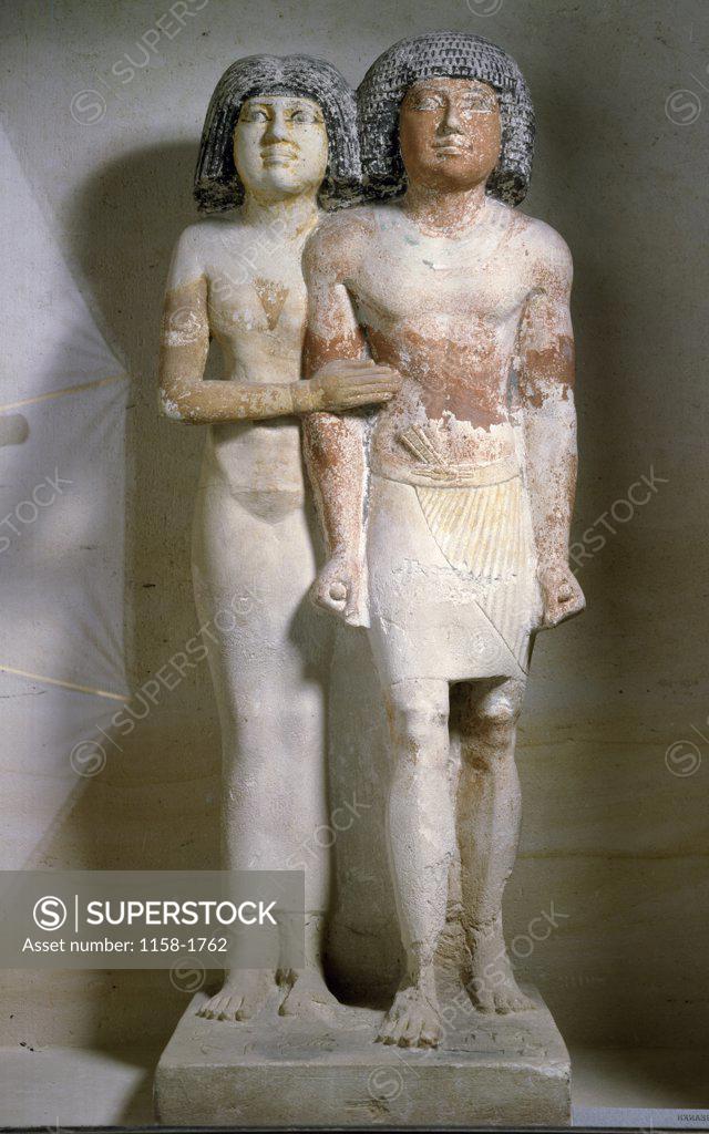 Stock Photo: 1158-1762 Statue of men and woman standing together, France, Paris, Musee du Louvre