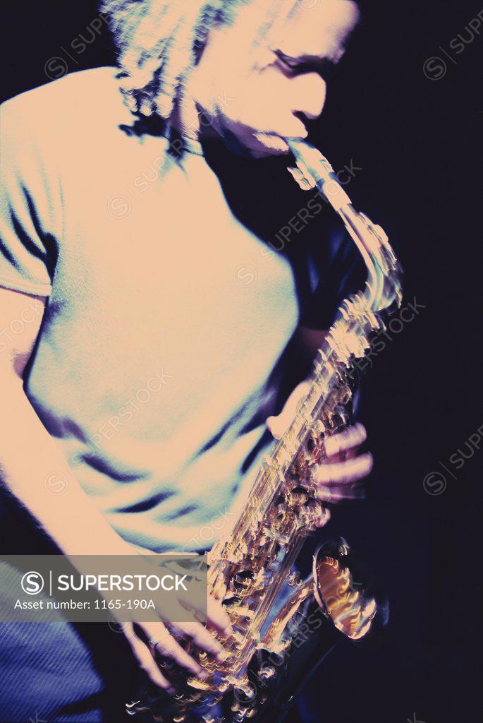 Stock Photo: 1165-190A Young man playing the saxophone
