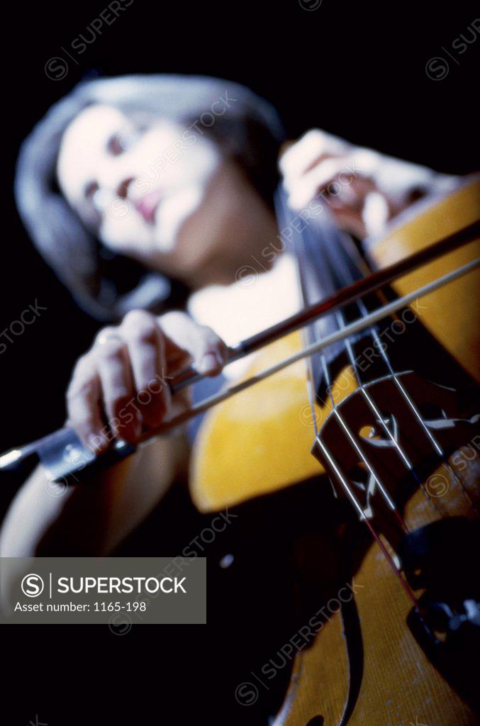 Stock Photo: 1165-198 Low angle view of a young woman playing the cello