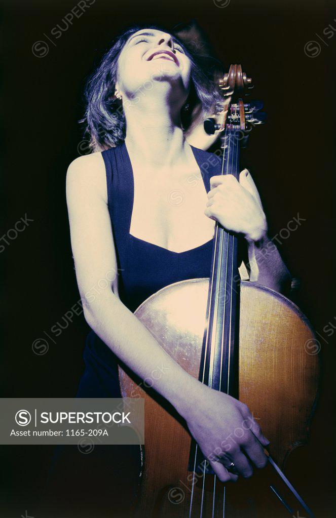 Stock Photo: 1165-209A Low angle view of a female cellist playing a cello