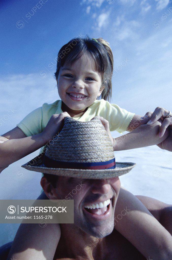 Stock Photo: 1165-278 Portrait of a girl sitting on her father's shoulders