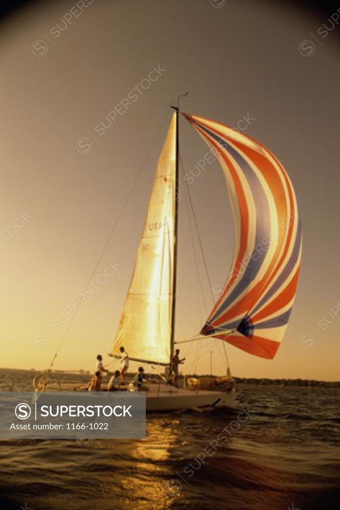 Stock Photo: 1166-1022 Group of people sailing on a sailboat
