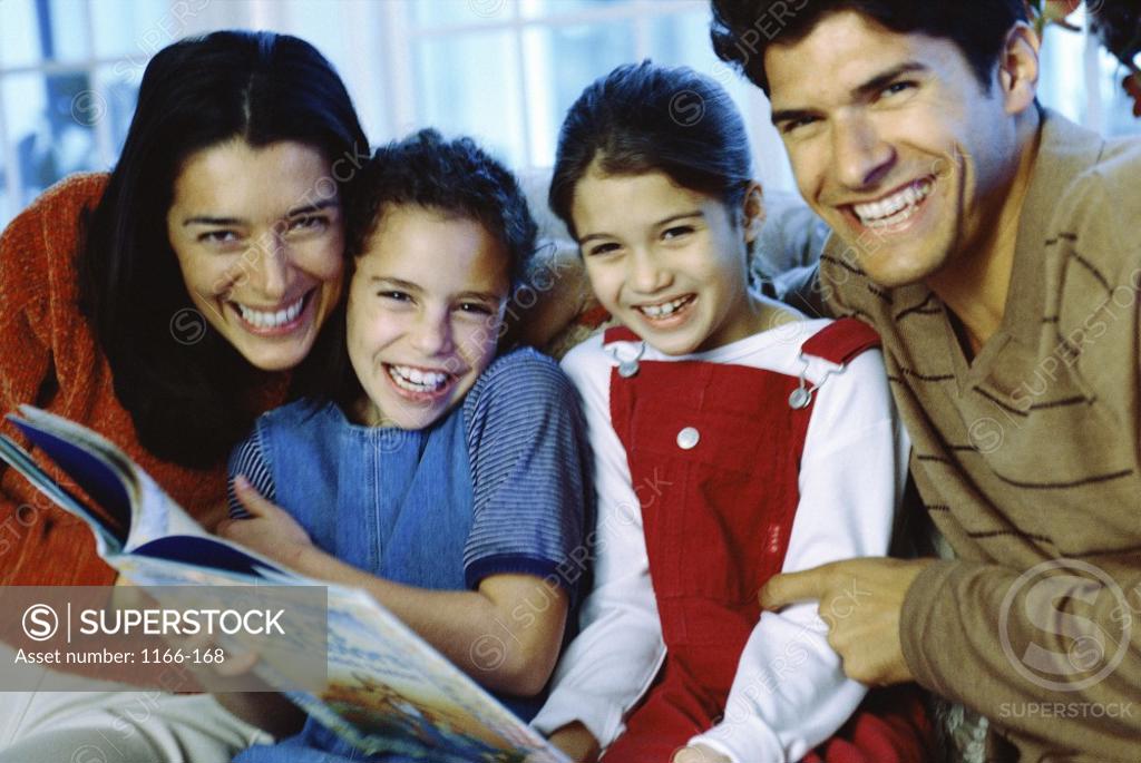 Stock Photo: 1166-168 Portrait of parents sitting with their two daughters