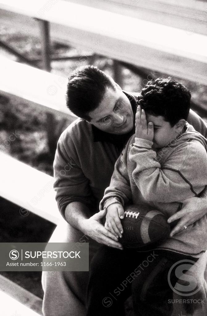 Stock Photo: 1166-1963 Father sitting with his son