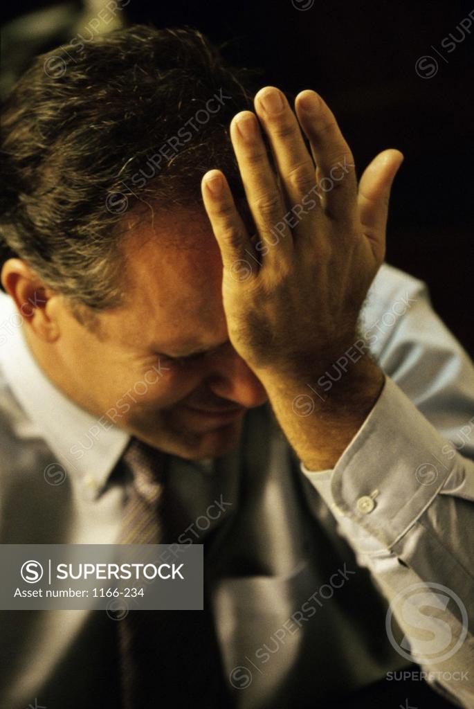 Stock Photo: 1166-234 Businessman with his hand on his head