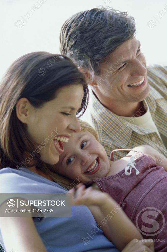 Stock Photo: 1166-2735 Parents laughing with their daughter