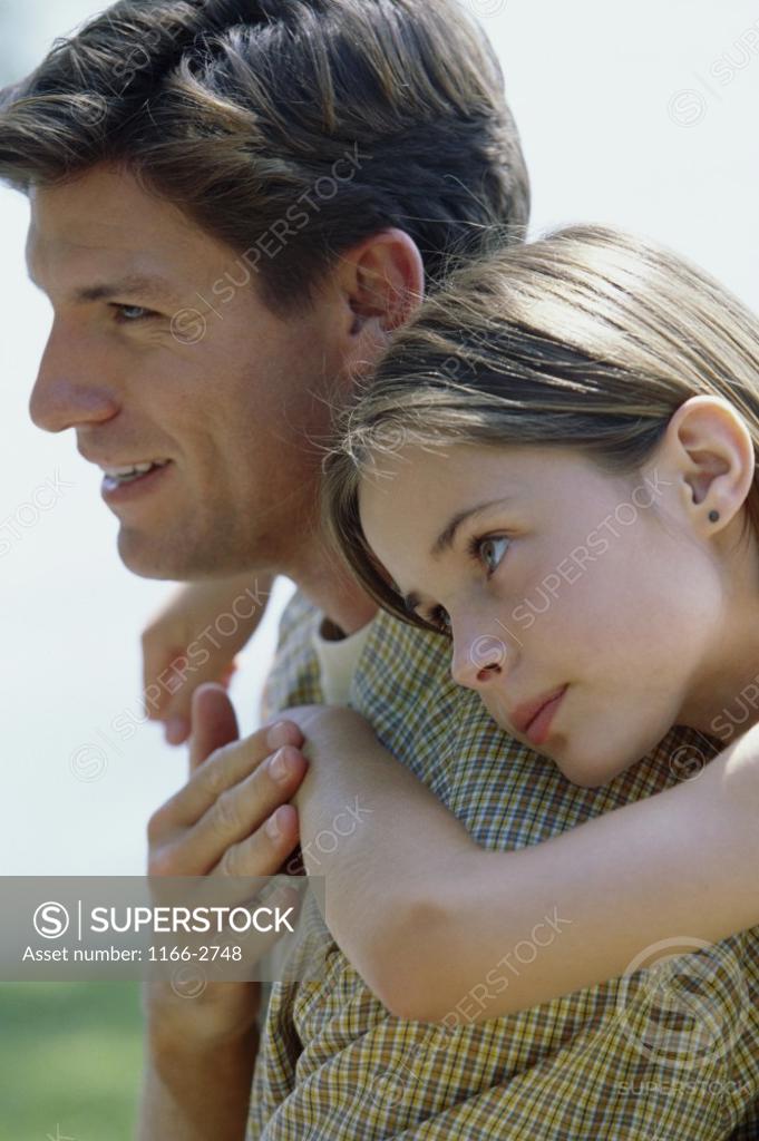 Stock Photo: 1166-2748 Side profile a father with his daughter