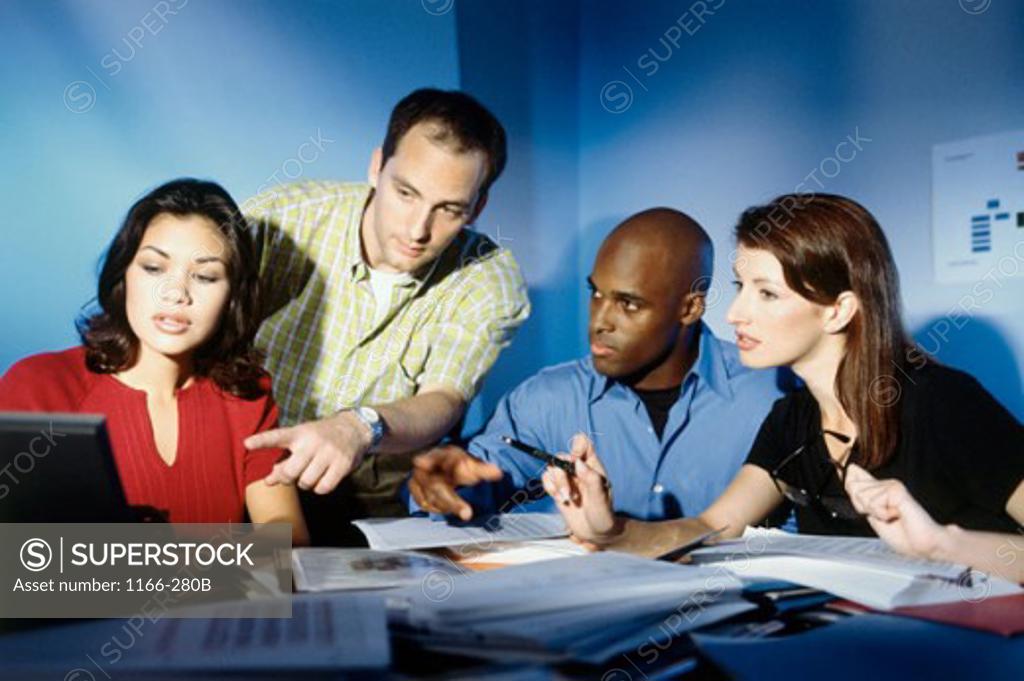 Stock Photo: 1166-280B Two businessmen and two businesswomen in a meeting