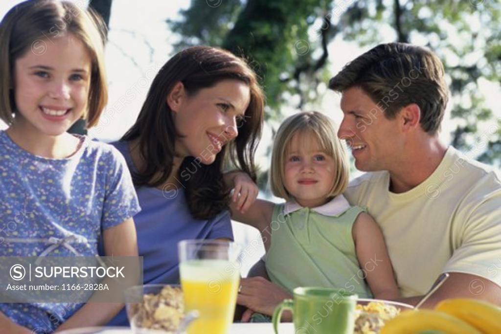 Stock Photo: 1166-2828A Parents with their two daughters