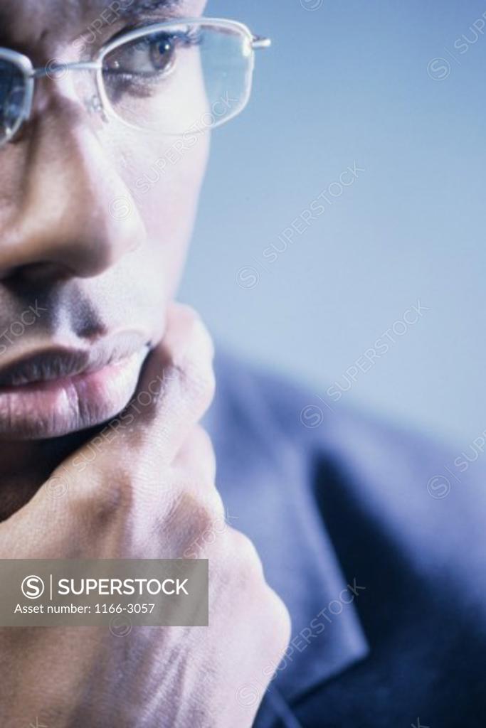 Stock Photo: 1166-3057 Close-up of a businessman with his hand on his chin