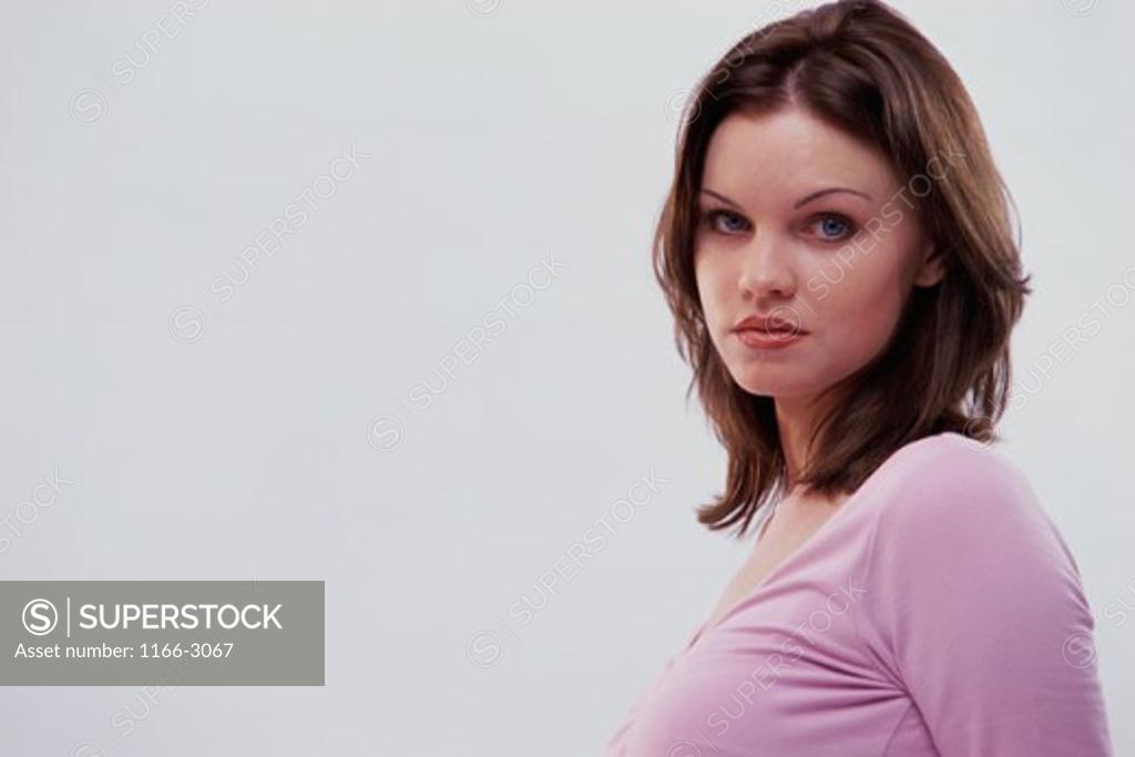 Stock Photo: 1166-3067 Side profile of a young woman looking serious