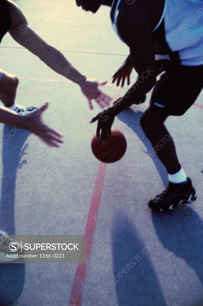 Stock Photo: 1166-3221 High angle view of men playing basketball