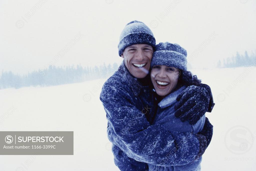 Stock Photo: 1166-3399C Portrait of a young couple hugging each other