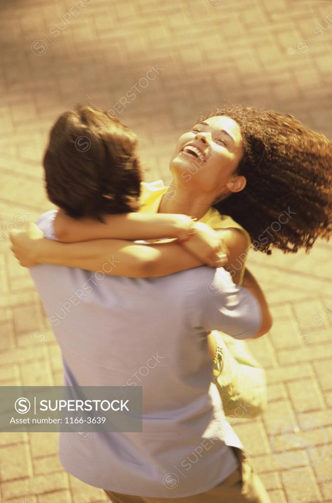 Stock Photo: 1166-3639 Young couple hugging each other