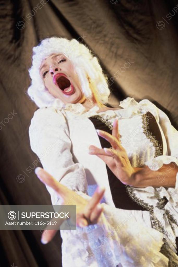 Stock Photo: 1166-5119 Low angle view of a female opera singer performing