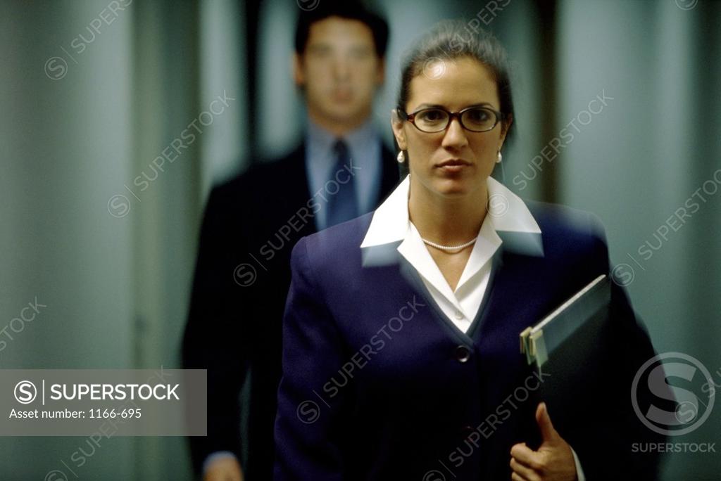 Stock Photo: 1166-695 Portrait of a businesswoman and a businessman behind her