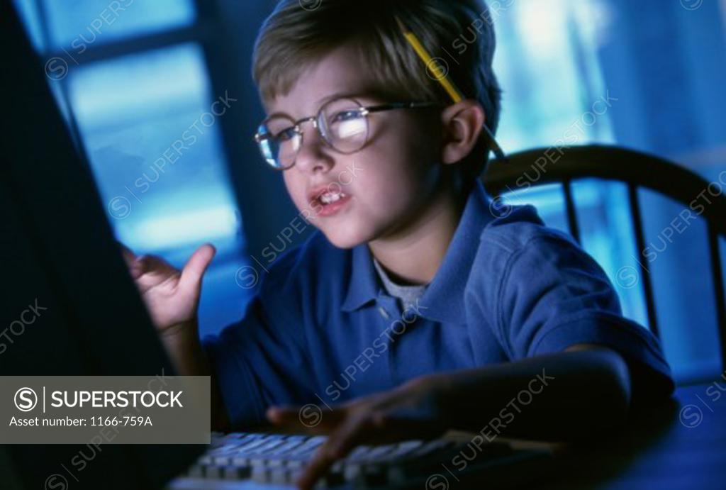 Stock Photo: 1166-759A Close-up of a boy using a computer