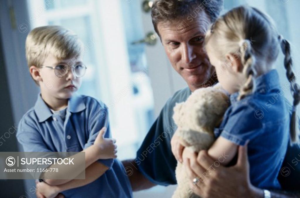 Stock Photo: 1166-778 Father holding his son and daughter