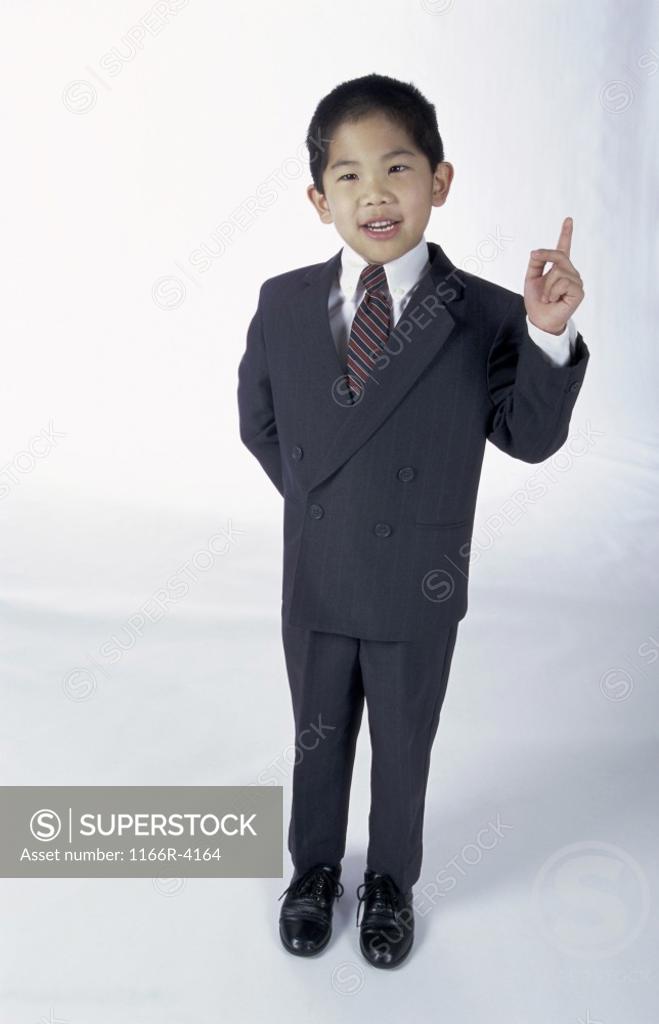 Stock Photo: 1166R-4164 Portrait of a young boy dressed as a businessman
