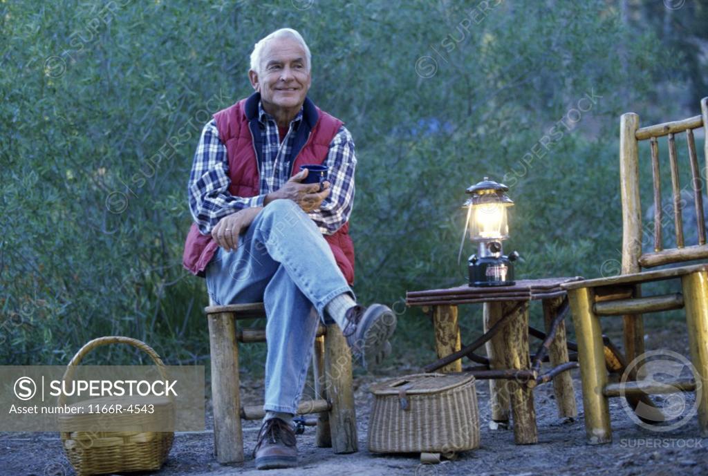 Stock Photo: 1166R-4543 Portrait of a senior man camping
