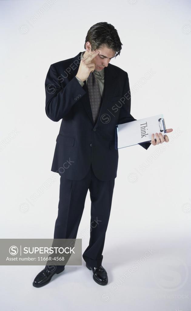Stock Photo: 1166R-4568 Businessman holding a clipboard