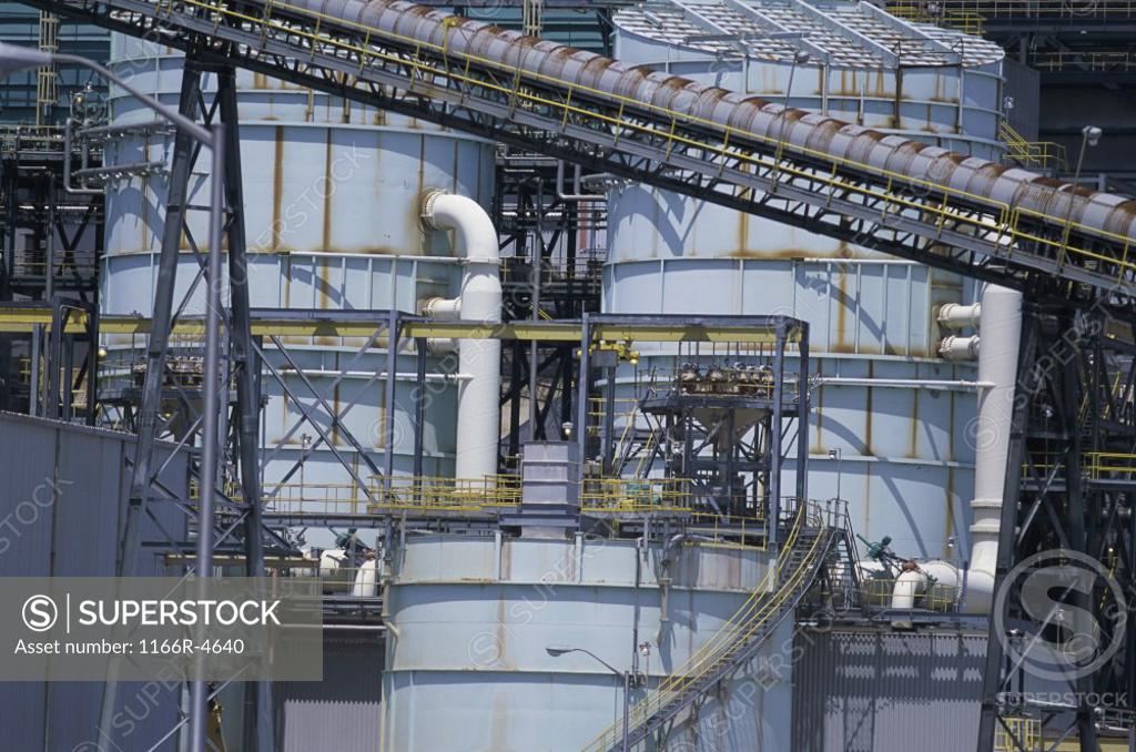 Stock Photo: 1166R-4640 Storage tanks and pipes at a power plant