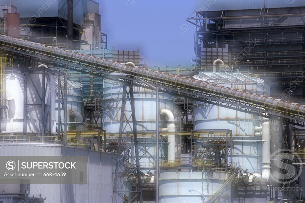 Stock Photo: 1166R-4659 Storage tanks and pipes at a power plant