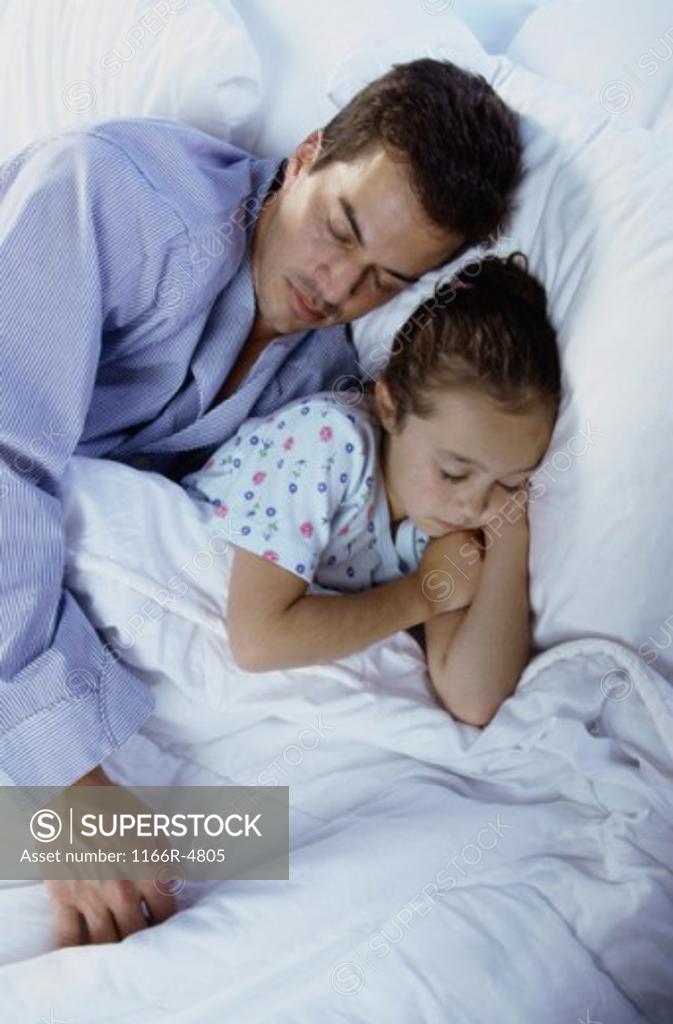 Stock Photo: 1166R-4805 Girl sleeping with her father